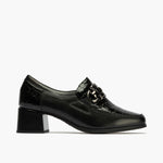 Abotinado con tacón medio y adorno de mujer color negro