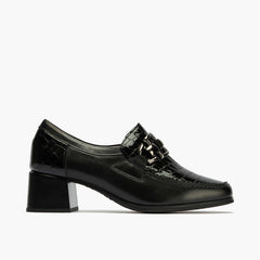 Abotinado con tacón medio y adorno de mujer color negro