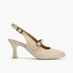 Zapato de salón destalonado con tacón alto, punta fina y pulsera Crema