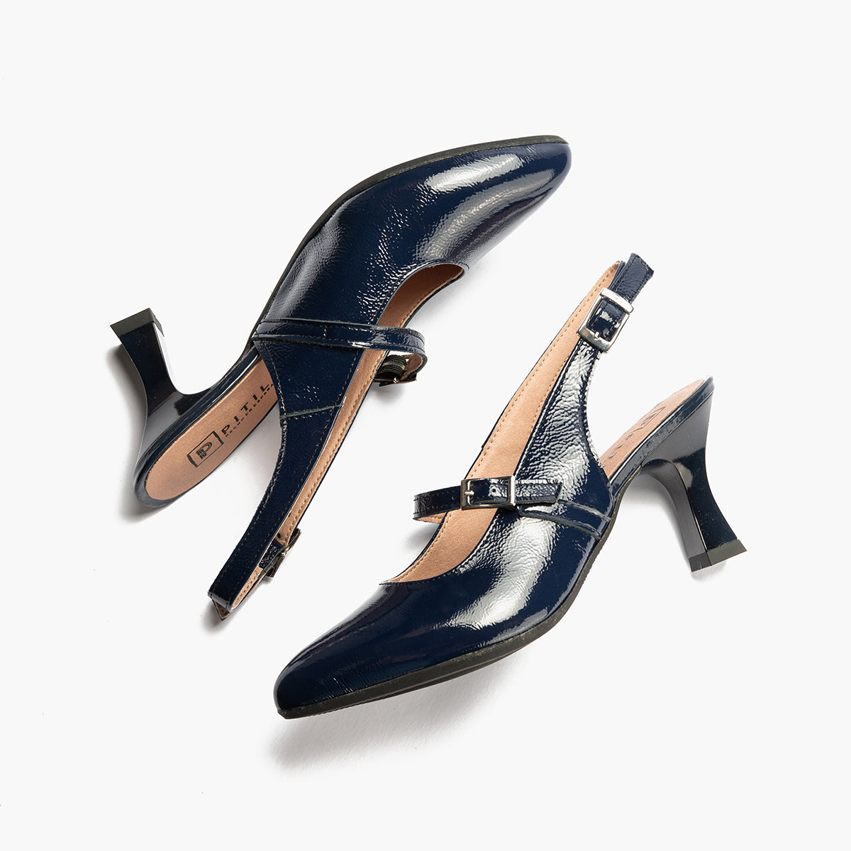 Zapato de salón destalonado con tacón alto, punta fina y pulsera Marino