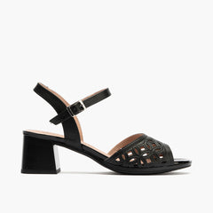 Sandalia con detalles metalizados, tacón medio y pulsera Negro