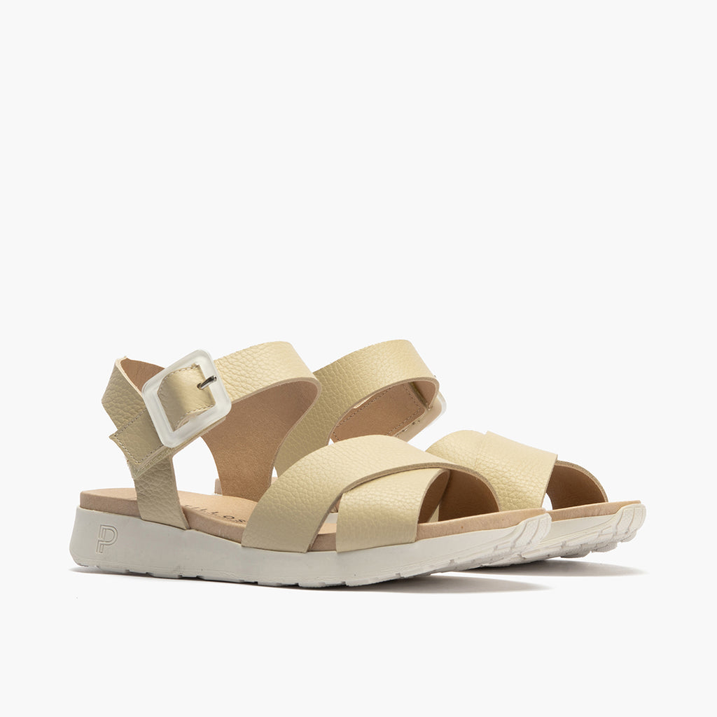 Sandalia deportiva con cruzados y pulsera Crema