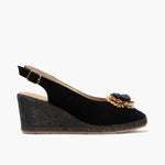 Sandalia estilo valenciana con cuña alta y detalle floral