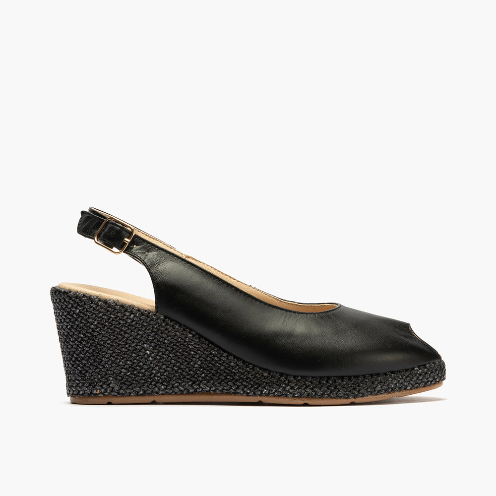 Sandalia estilo valenciana con cuña alta y combinado en piel Negro