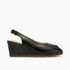Sandalia estilo valenciana con cuña alta y combinado en piel Negro