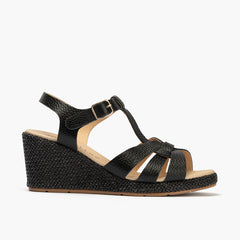 Sandalia estilo valenciana con cuña alta y combinado en piel Negro