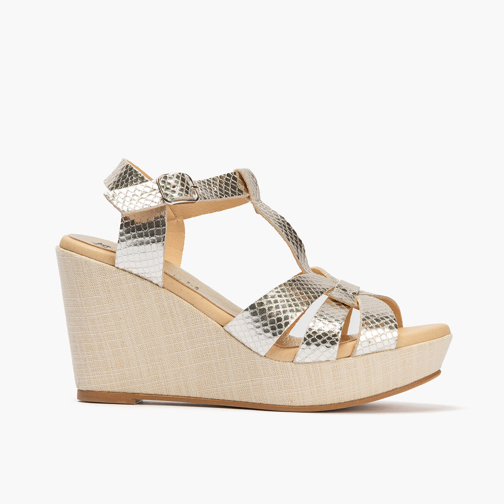 Sandalia con cuña alta en piel con efecto animal print Oro